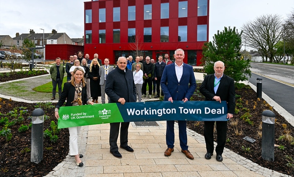 People in front of the Workington Innovation Centre building