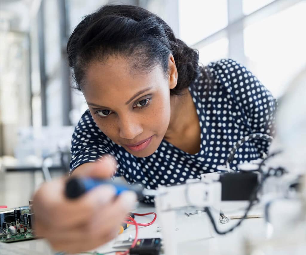 Woman working on electronics
